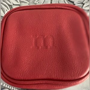 Muted Red leather “m” monogrammed jewelry travel case